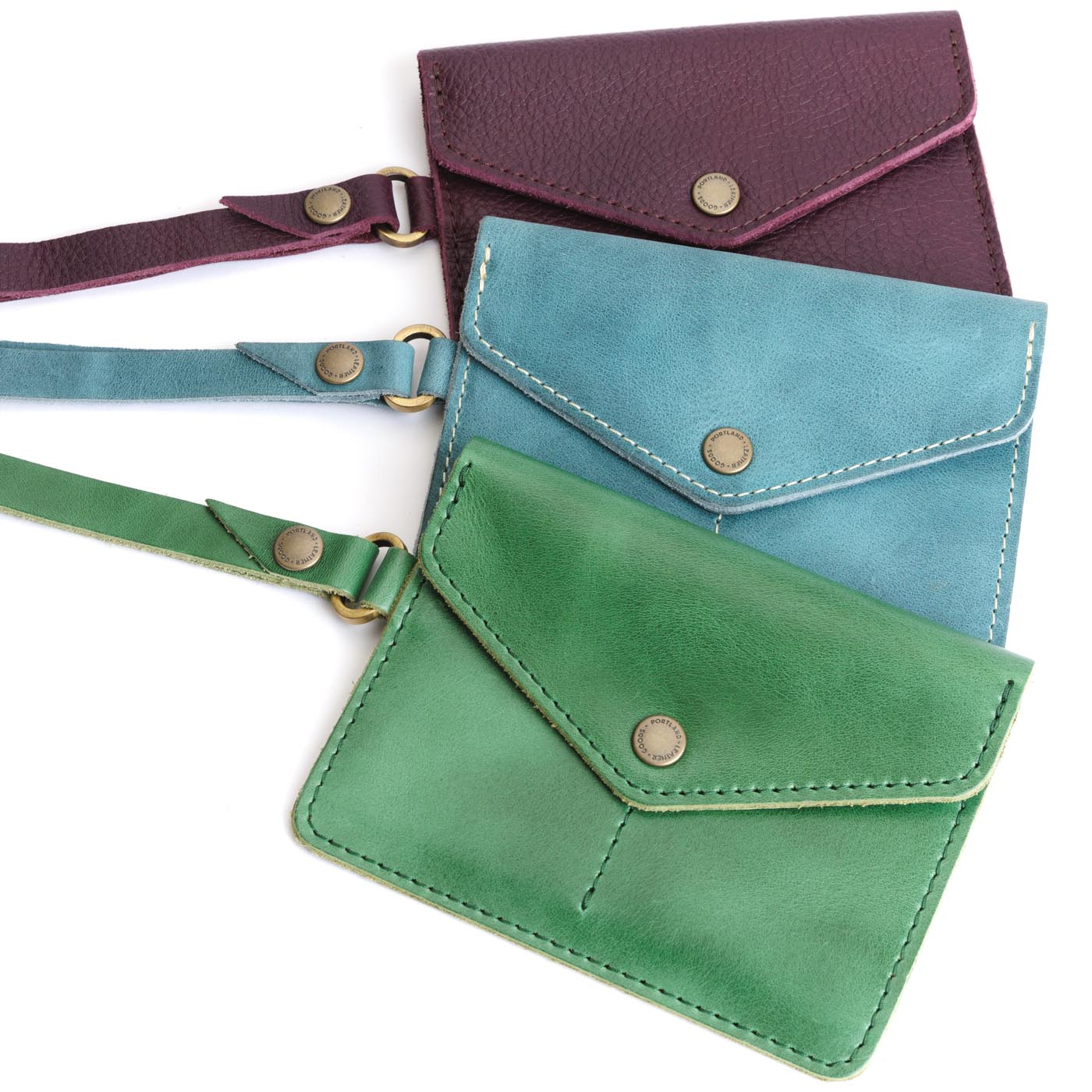| Three Leather Passport Wristlets