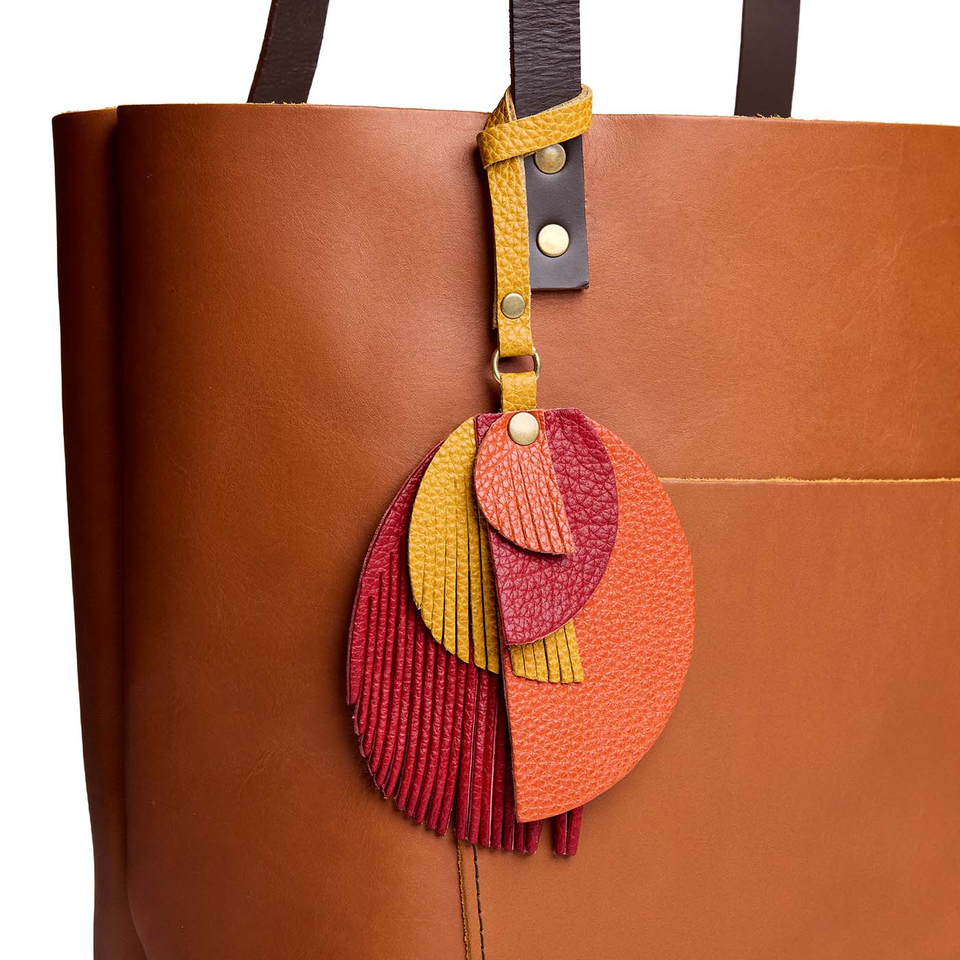 Scarlet Heart | Intricately cut leather shapes and fringe