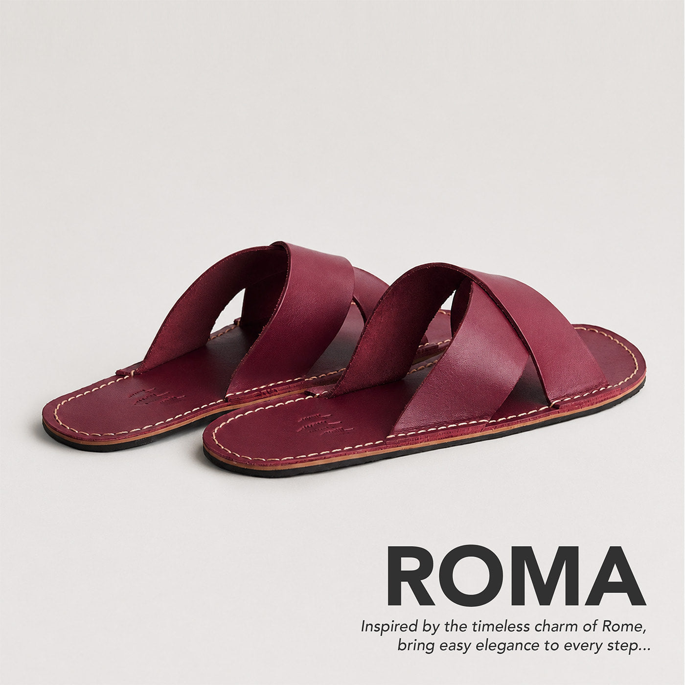 Marsala | Flat leather sandals with debossed PLG three tree logo in sole, text reads "Roma. Inspired by the timeless charm of Rome, bring easy elegance to every step..."