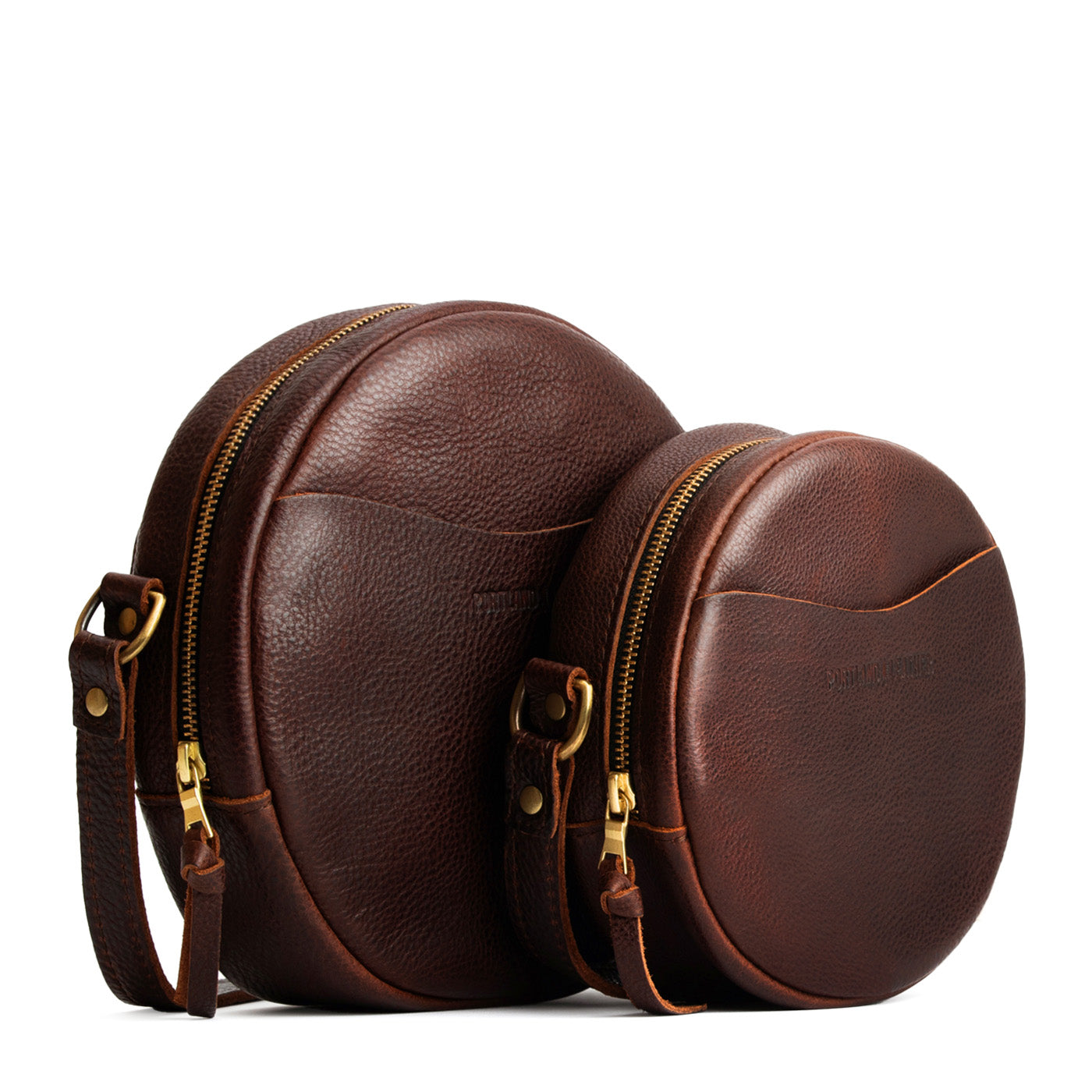 Coldbrew | Size comparison image of small and large circle shaped crossbody bags with top zipper