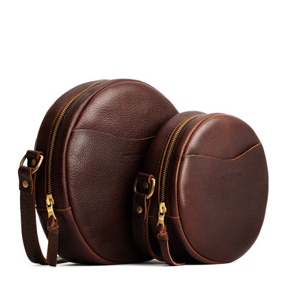 Coldbrew | Size comparison image of small and large circle shaped crossbody bags with top zipper