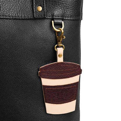 PLG Coffee | Keychain shaped like a to-go coffee cup with a swivel lobster clasp on a bag