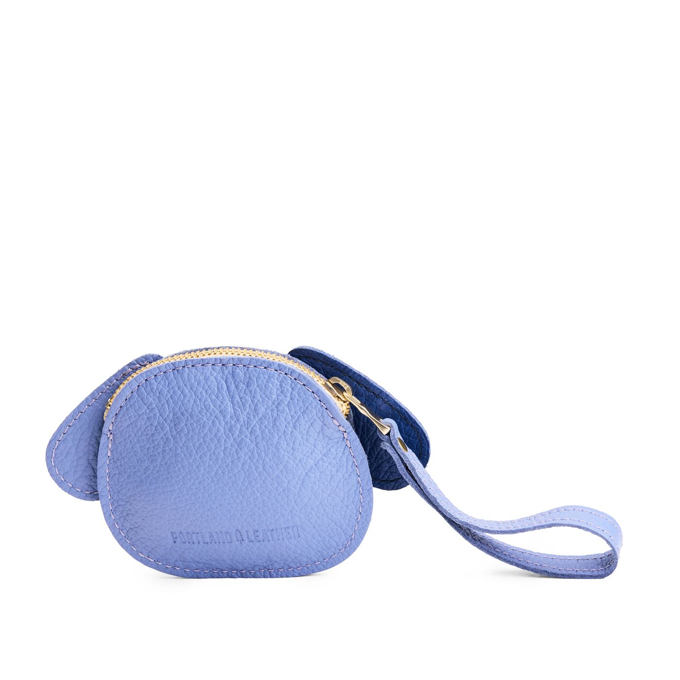 Aster | A small dog-shaped leather pouch with embroidered facial details and a wrist strap.