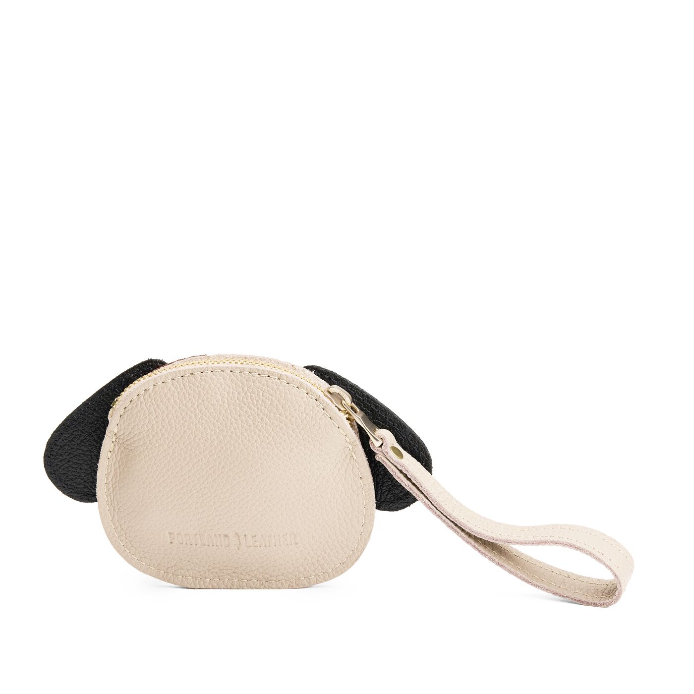 Oatmilk | A small dog-shaped leather pouch with embroidered facial details and a wrist strap.