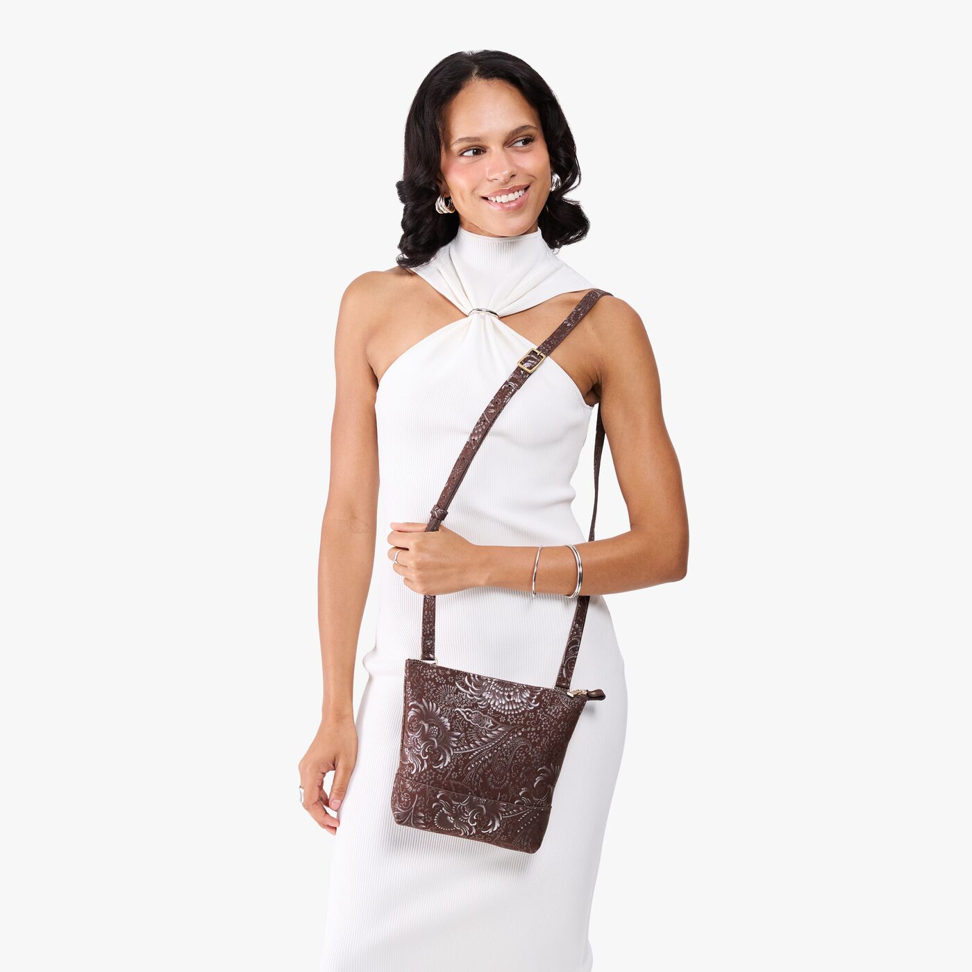 Sepia | Model wearing small rectangular crossbody purse with top zipper and interior pocket
