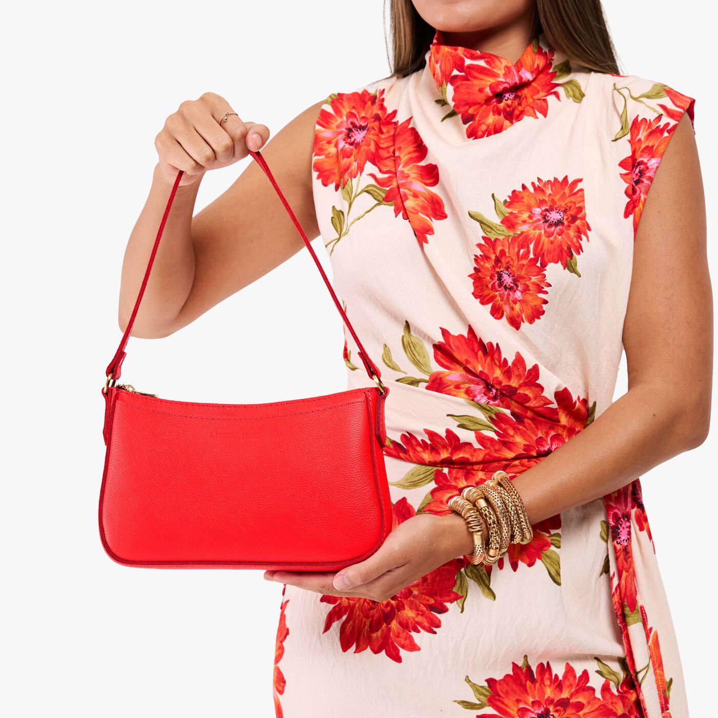 Candy*Small | Model carrying petite bean shaped shoulder bag with a zipper closure