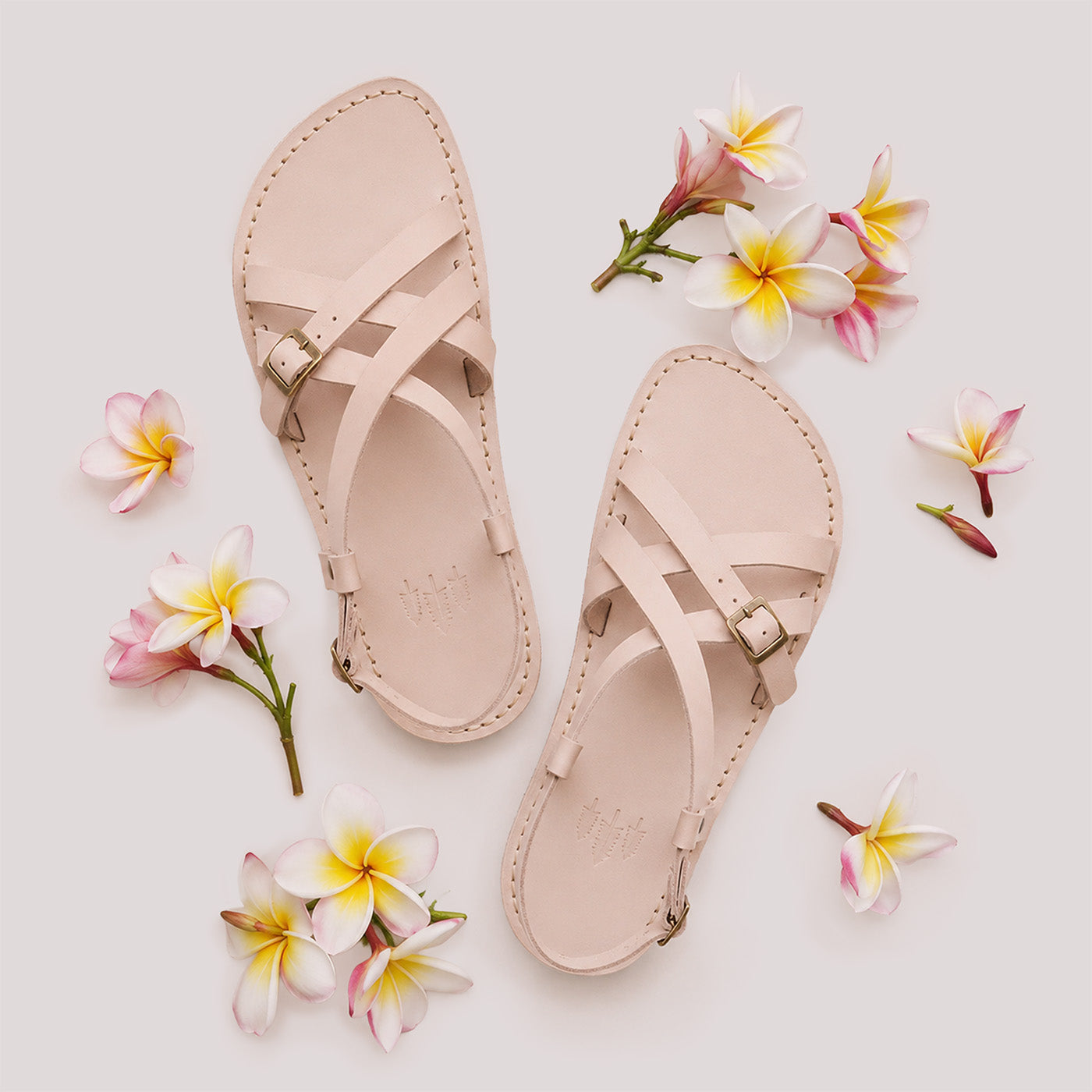 Crema | Strappy leather sandals with two buckle accents