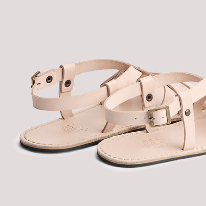 Crema | Strappy leather sandals with two buckle accents