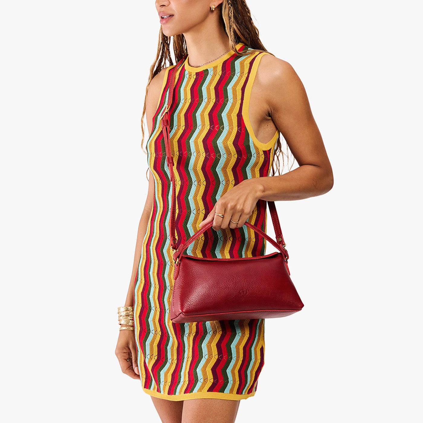 Chili Red | Model holding a red bowler style hand bag
