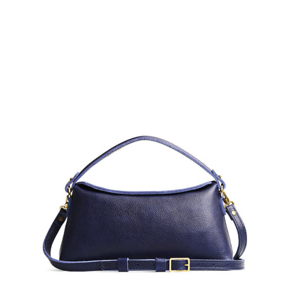 Cobalt | Leather bowler bag with magnetic closure against a white background