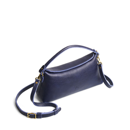 Cobalt | Leather bowler bag with magnetic closure against a white background