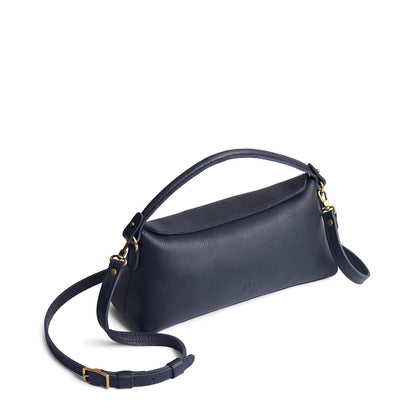 Night Owl | Leather bowler bag with magnetic closure against a white background
