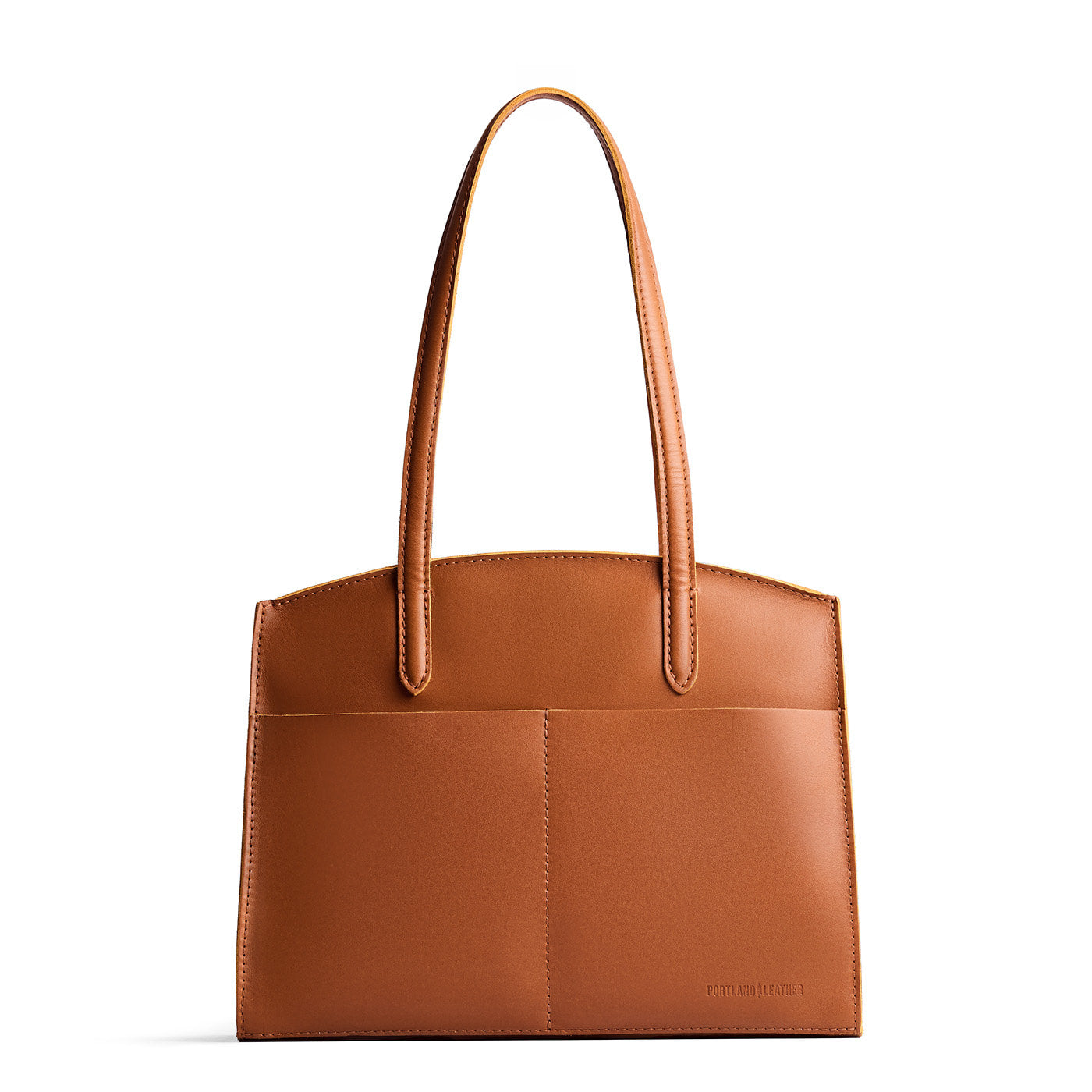 Honey*Large | Leather tote bag with handles, adjustable crossbody strap, zipper top, and two back pockets