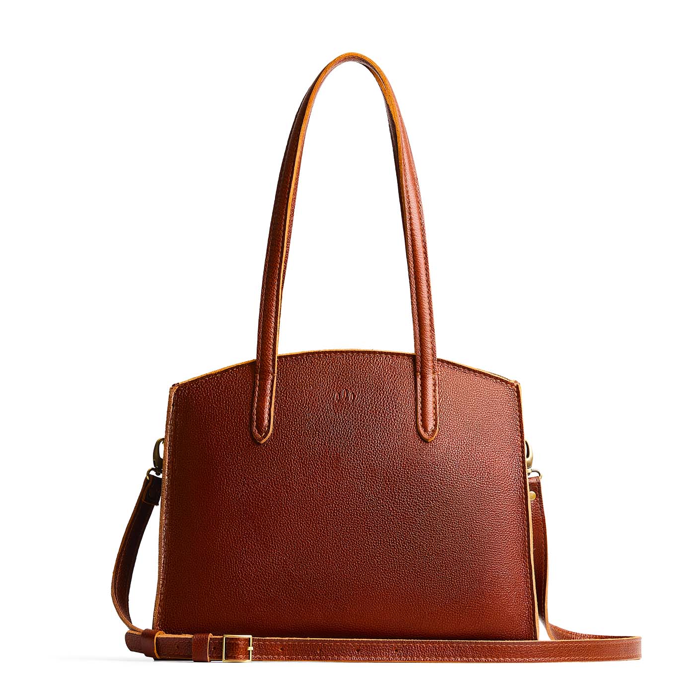 Nutmeg*Large | Leather tote bag with handles, adjustable crossbody strap, zipper top, and two back pockets