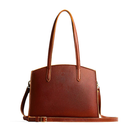 Nutmeg*Large | Leather tote bag with handles, adjustable crossbody strap, zipper top, and two back pockets