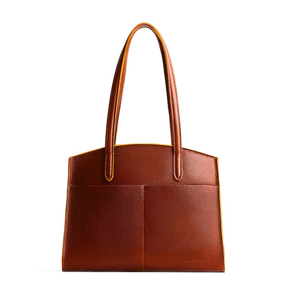 Nutmeg*Large | Leather tote bag with handles, adjustable crossbody strap, zipper top, and two back pockets