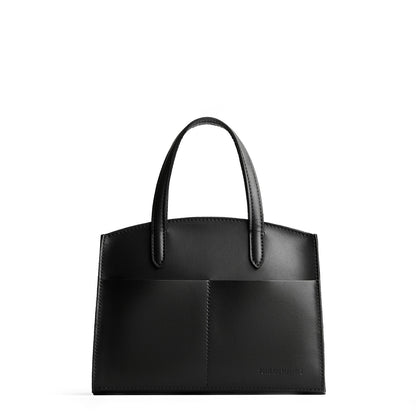 Black*Medium| Leather tote bag with handles, adjustable crossbody strap, zipper top, and two back pockets