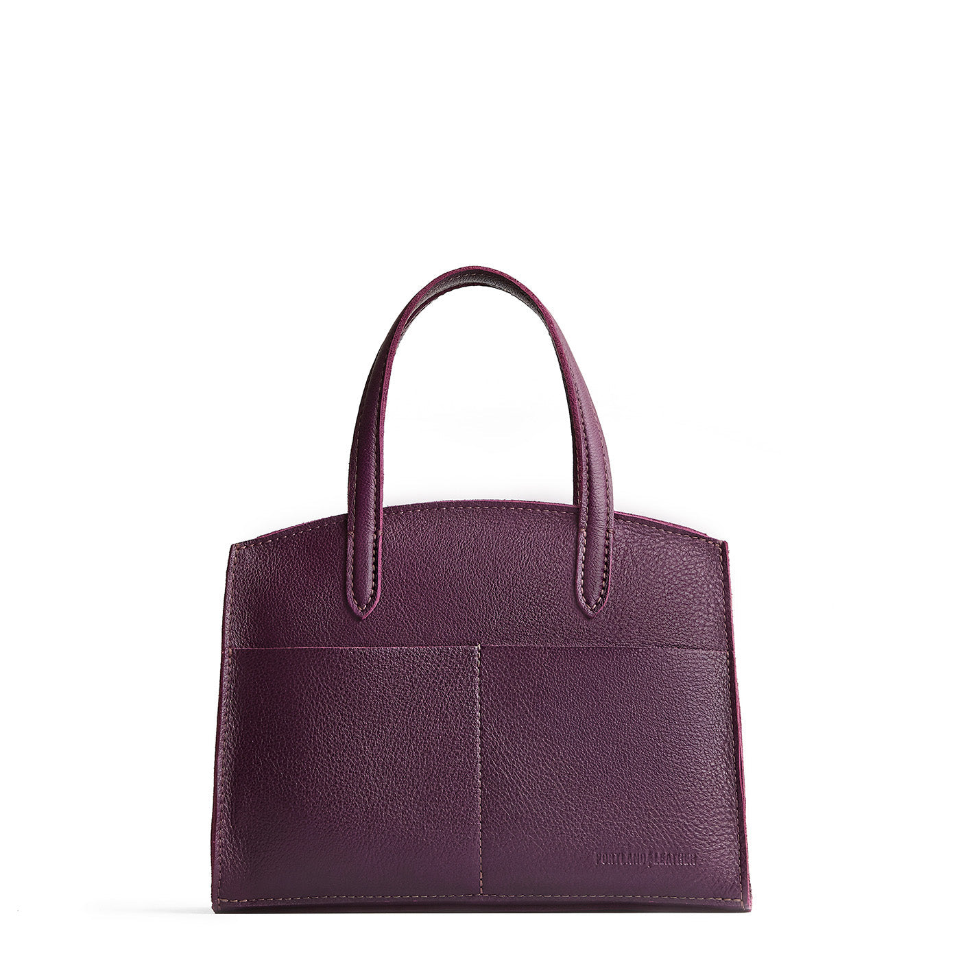 Plum*Medium | Leather tote bag with handles, adjustable crossbody strap, zipper top, and two back pockets