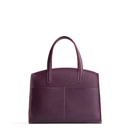 Plum*Medium | Leather tote bag with handles, adjustable crossbody strap, zipper top, and two back pockets