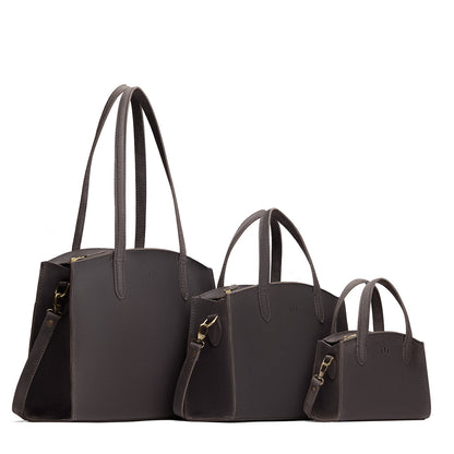 Full Moon | Size comparison image of Mini, Medium, and Large-sized leather tote bags with handles, adjustable crossbody strap, zipper top, and back pockets