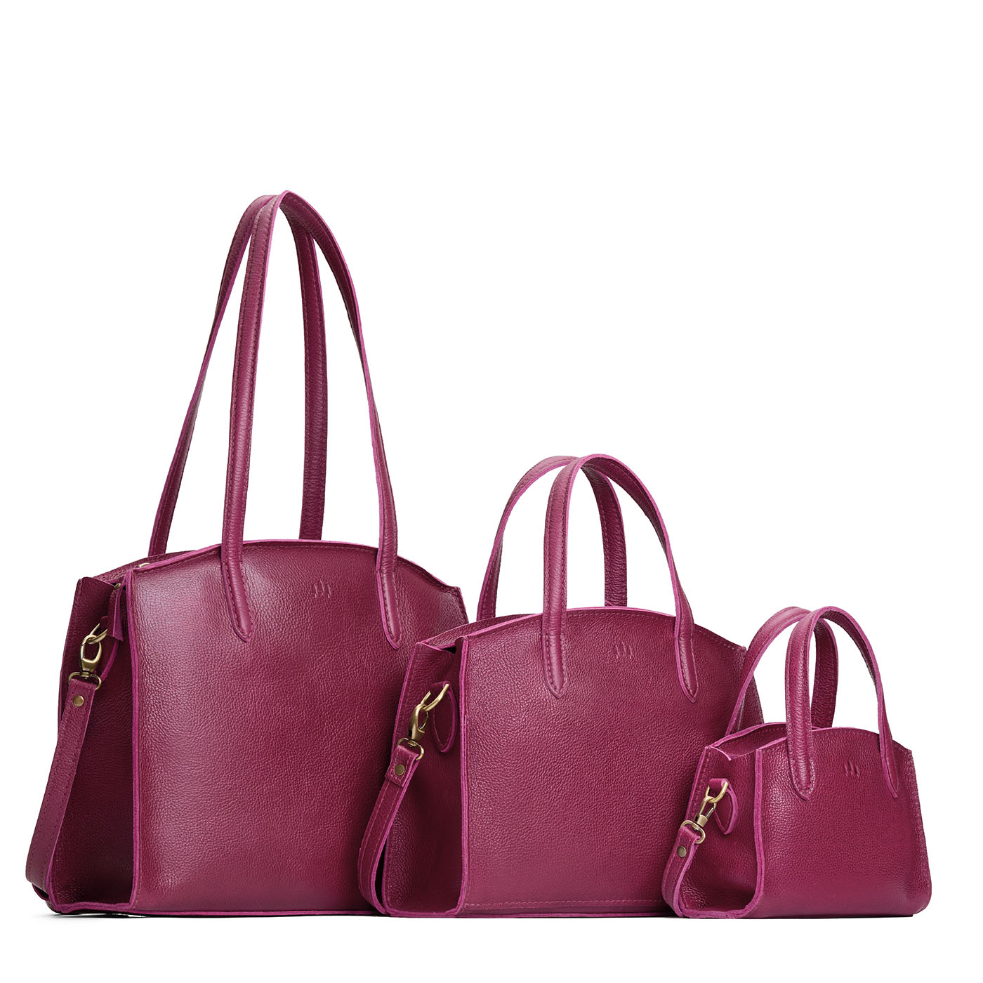 Orchid | Size comparison image of Mini, Medium, and Large-sized leather tote bags with handles, adjustable crossbody strap, zipper top, and back pockets