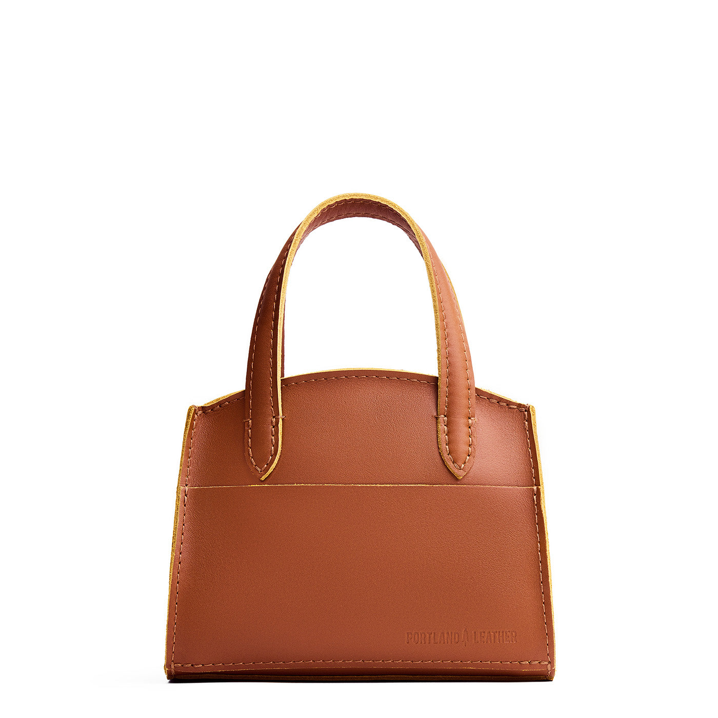 Honey*Mini | Leather tote bag with handles, adjustable crossbody strap, zipper top, and a back pocket