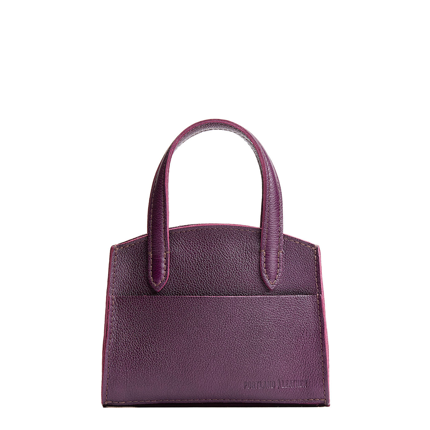 Plum*Mini | Leather tote bag with handles, adjustable crossbody strap, zipper top, and a back pocket