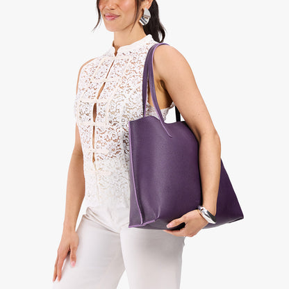 Empire*Large | Model carrying leather tote bag with matching leather handles