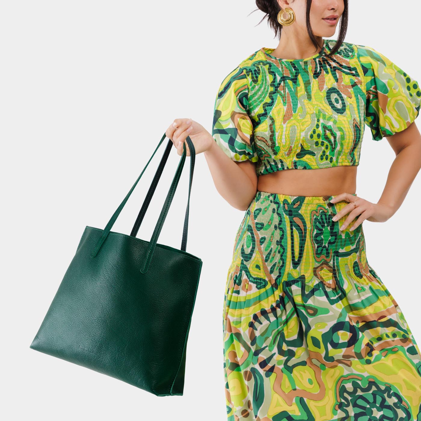 Forest Green*Large | Model holding leather tote bag with interior snap key loop