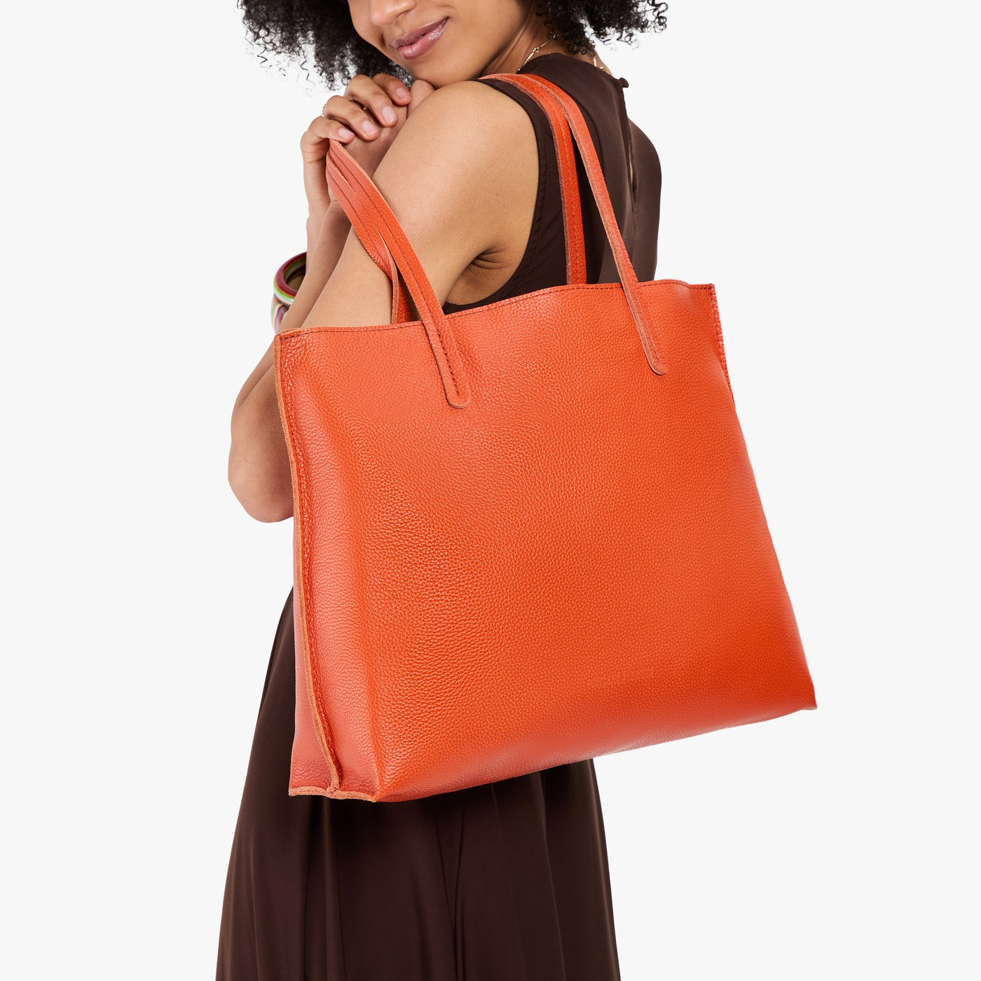 Koi*Large | Model carrying leather tote bag with matching leather handles