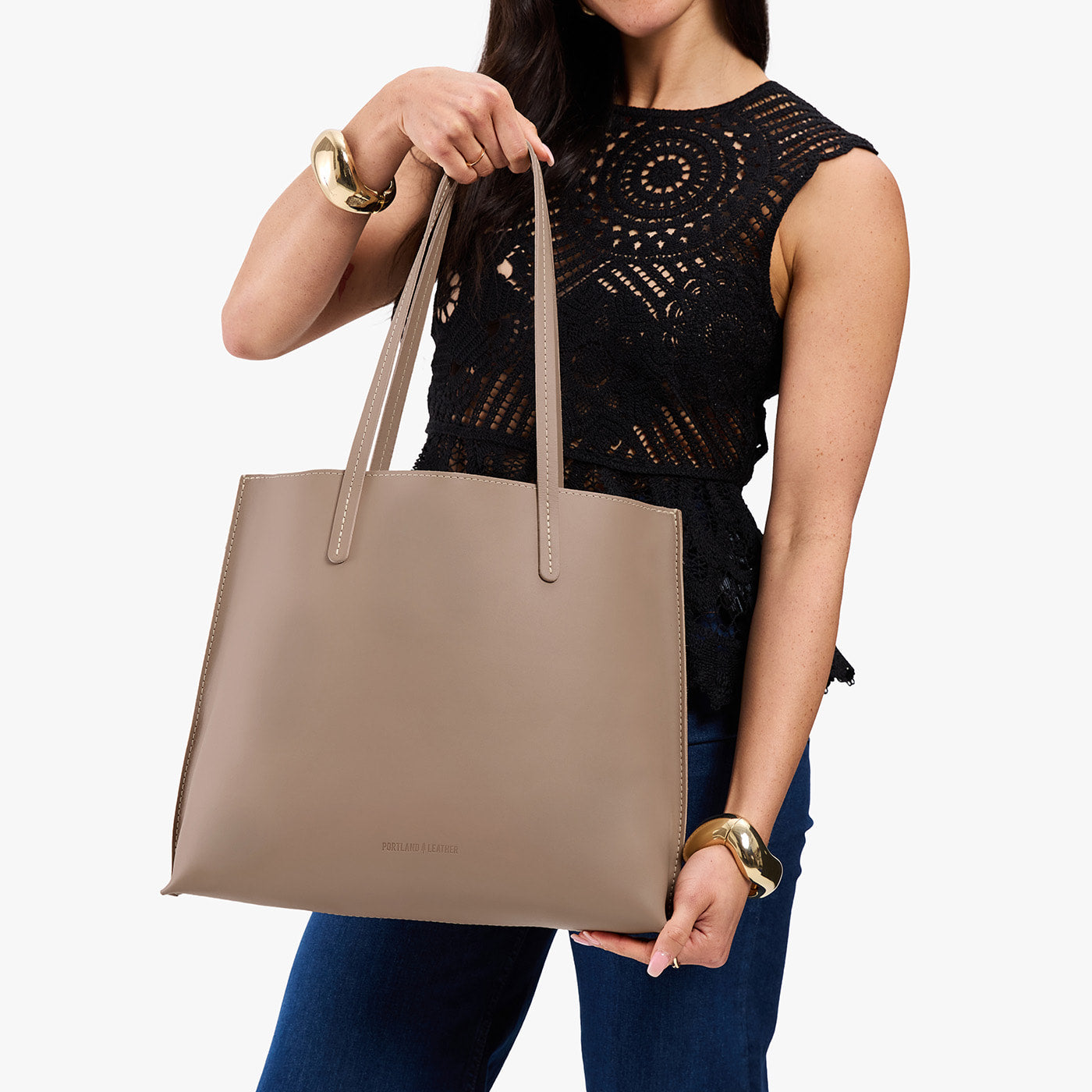 Stone*Large | Model holding leather tote bag with matching leather handles
