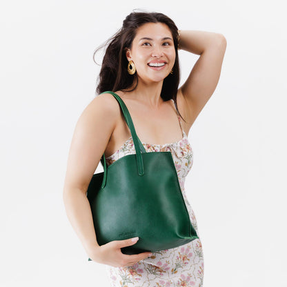 Bacalar*Medium | Model holding leather tote bag with interior snap key loop