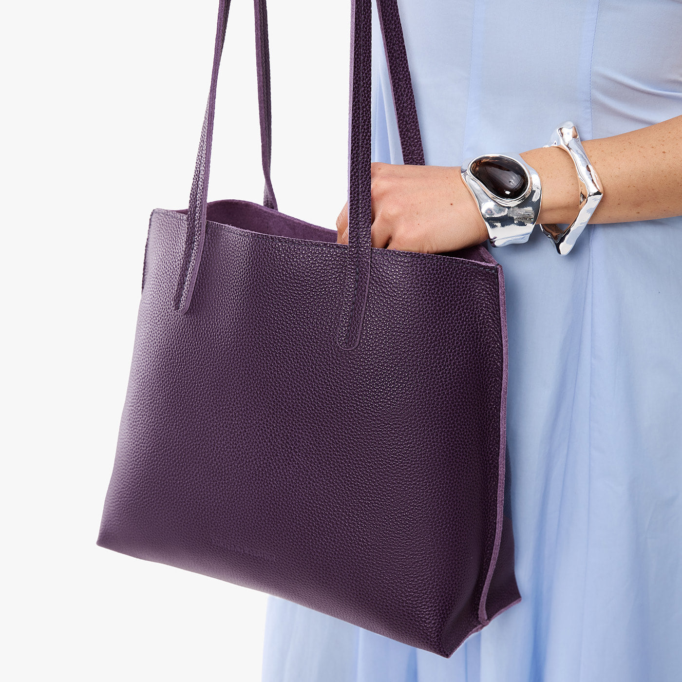 Empire*Medium | Model holding leather tote bag with matching leather handles