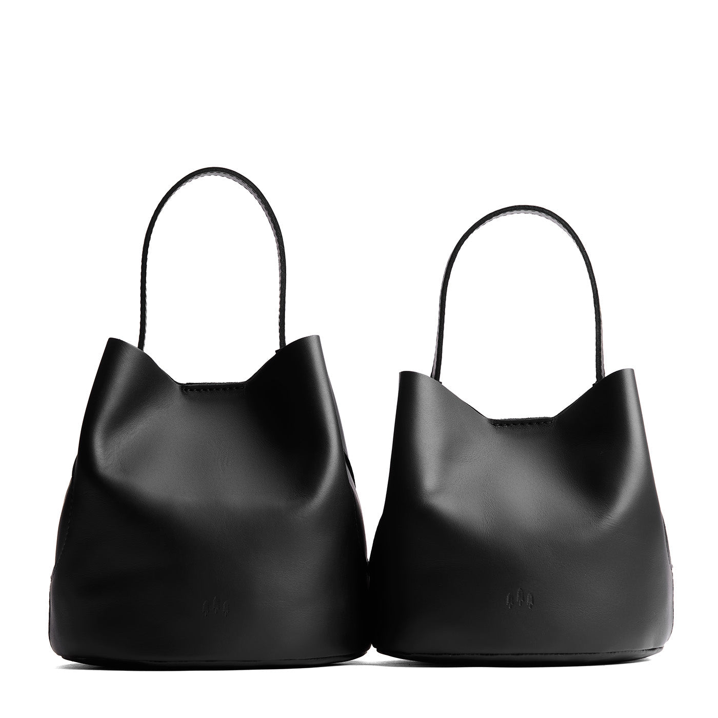 Black | Size comparison image of two symmetrical leather bucket bags