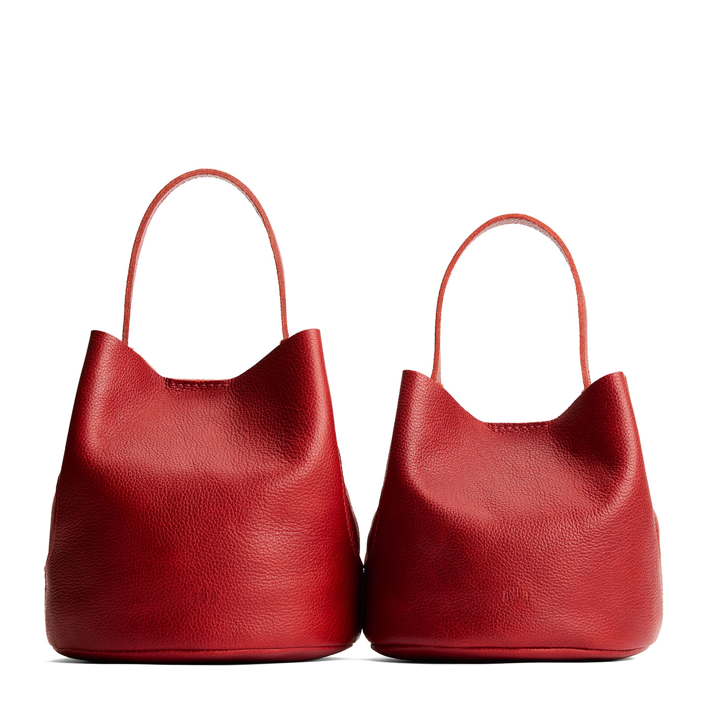Chili Red | Size comparison image of two symmetrical leather bucket bags