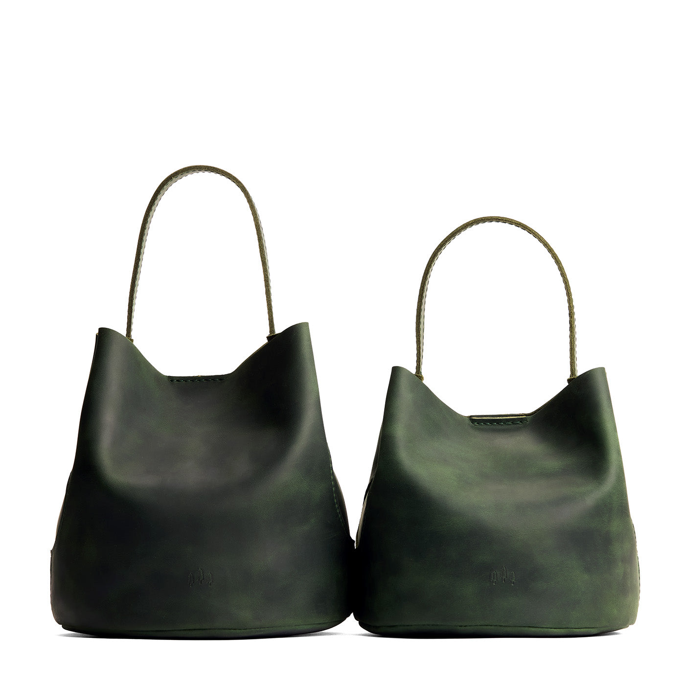 Evergreen | Size comparison image of two symmetrical leather bucket bags