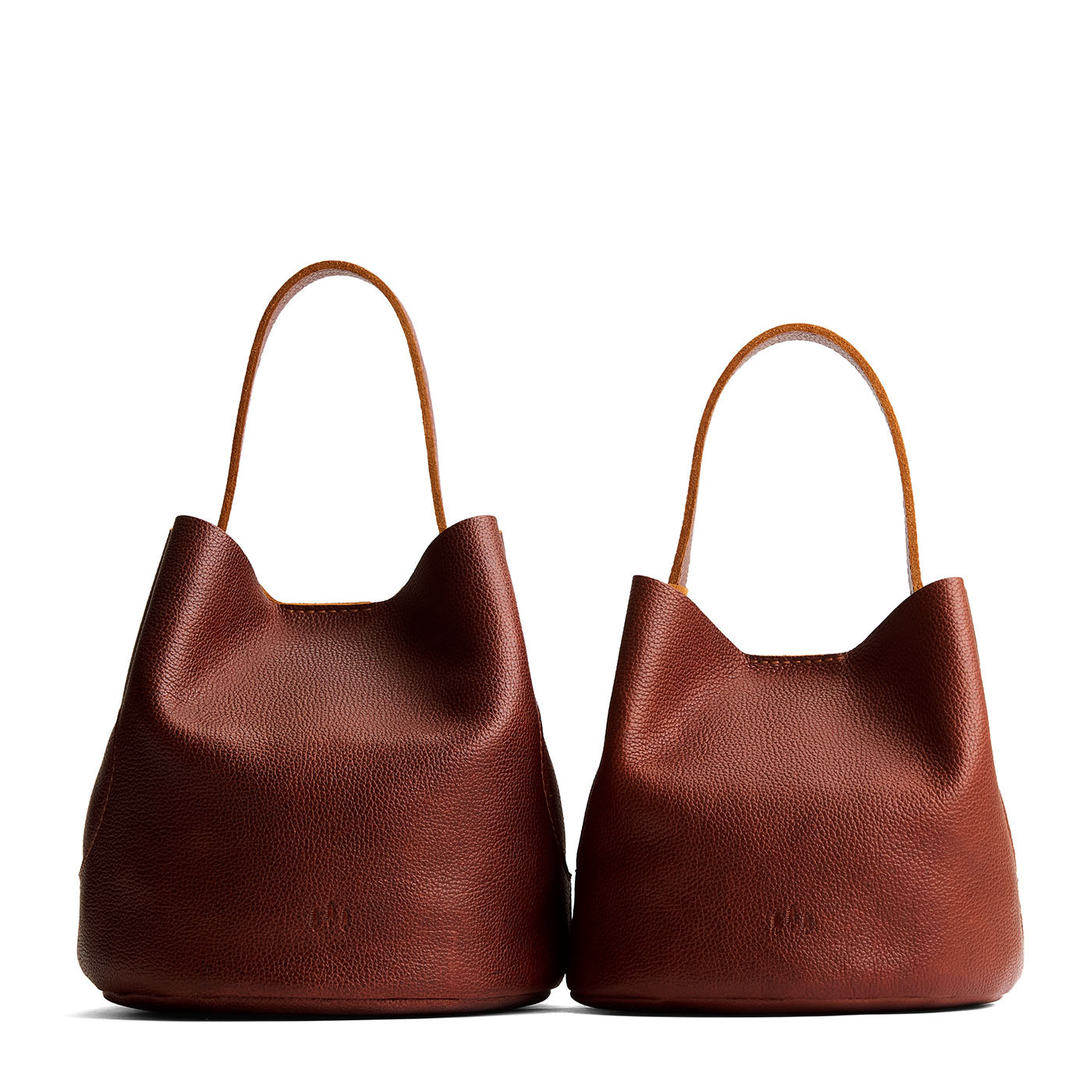 Nutmeg | Size comparison image of two symmetrical leather bucket bags