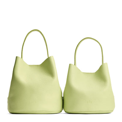 Shadow Lime | Size comparison image of two symmetrical leather bucket bags