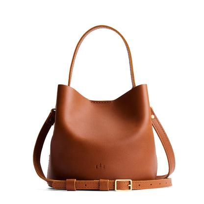 Honey*Small | Symmetrical bucket bag with handle, latch closure, and removable crossbody strap