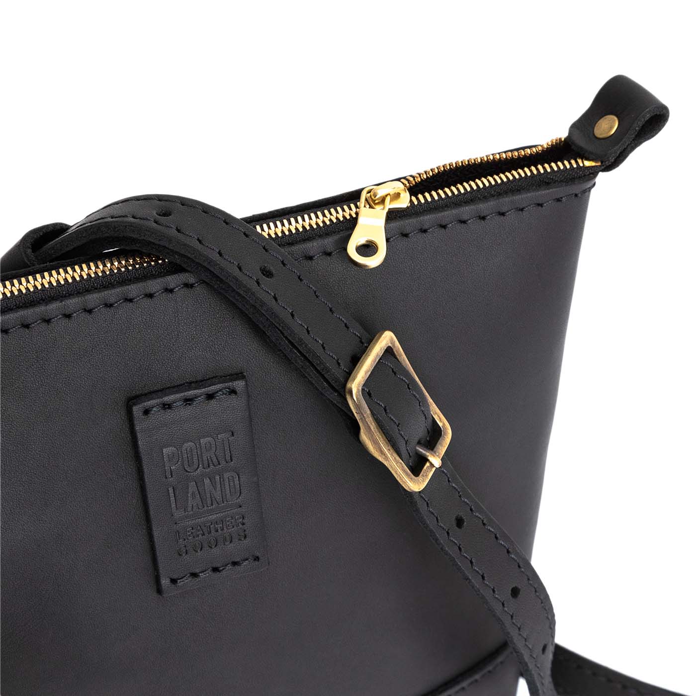 Black | Small rectangular crossbody purse with top zipper and interior pocket