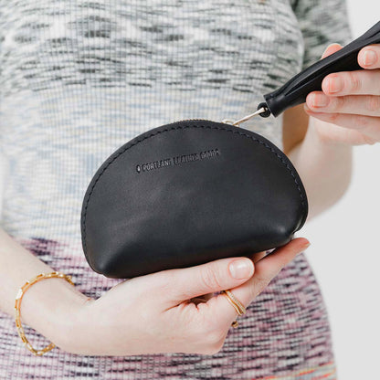 Black | Small leather zippered pouch with tassel