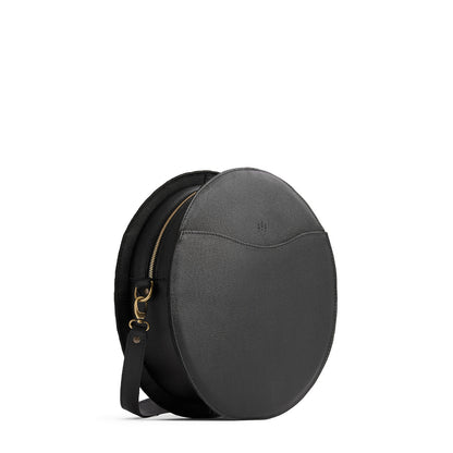 Pebbled--black | Large circle shaped leather bag with top zipper and carrying strap
