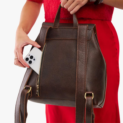 Coldbrew | Model wearing a leather backpack on a white background