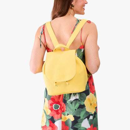 Butter Bliss | Pebbled leather drawstring backpack being worn by a person