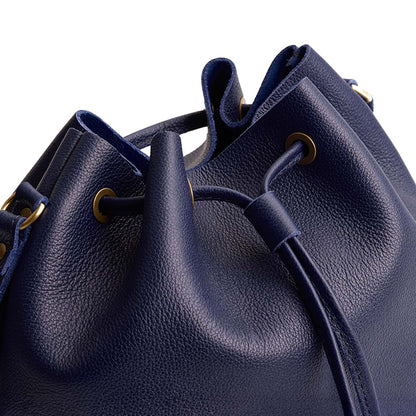 Cobalt | Close-up of slouchy crossbody bag with leather drawstring closure