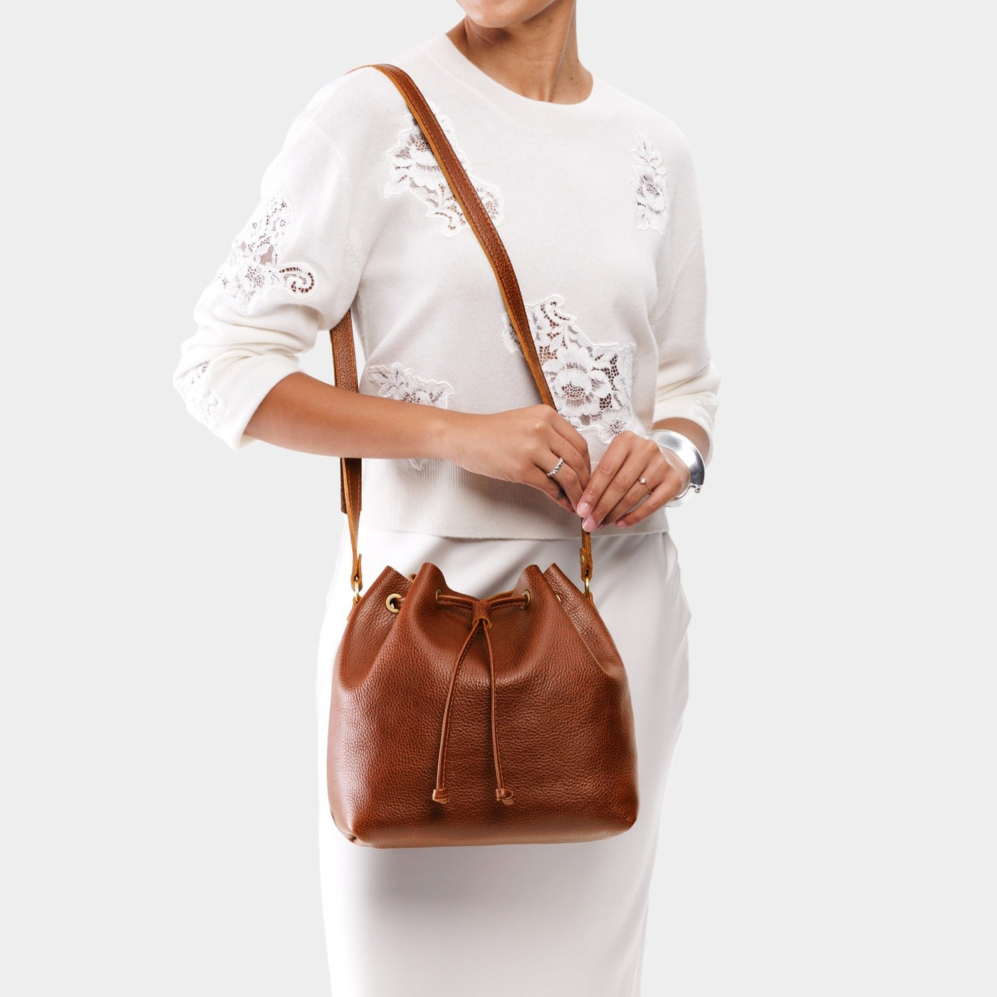 Nutmeg*Large | Model wearing slouchy crossbody bag with drawstring closure