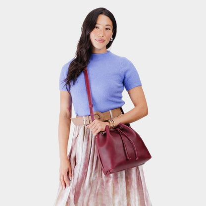 Orchid*Large | Model wearing slouchy crossbody bag with drawstring closure