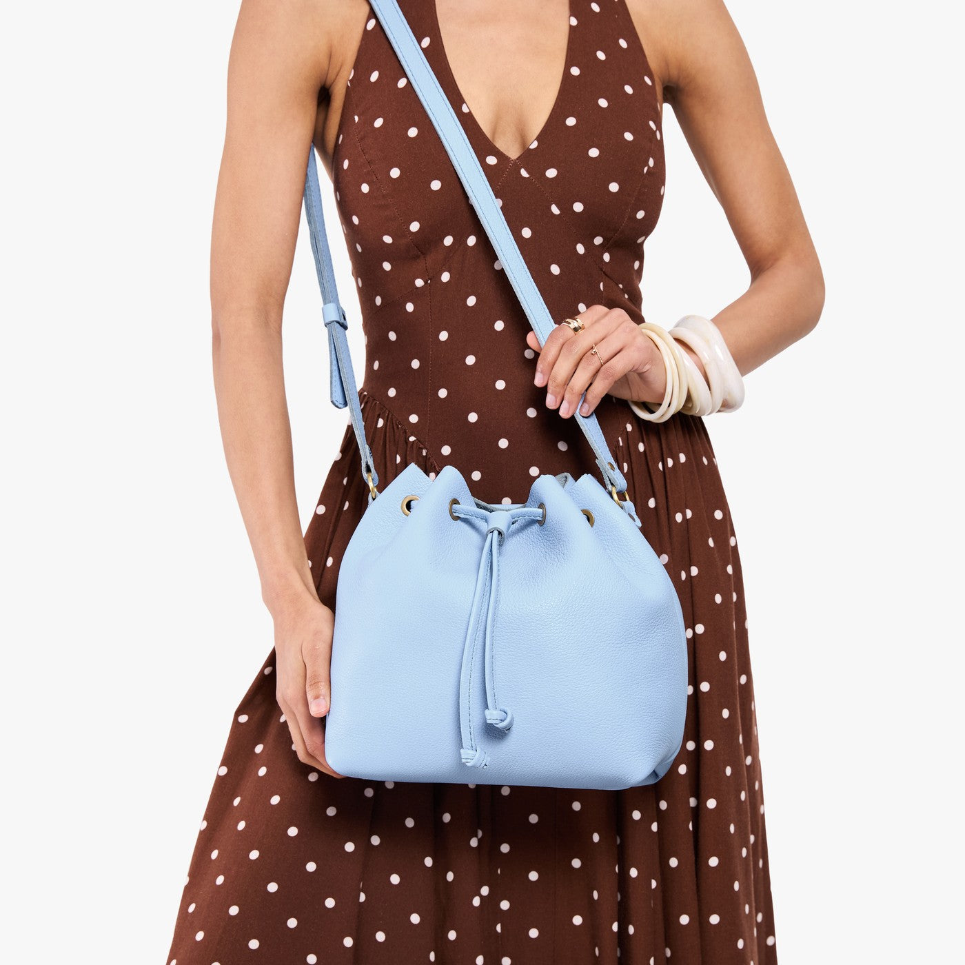 Skyway*Large | Model wearing slouchy crossbody bag with drawstring closure