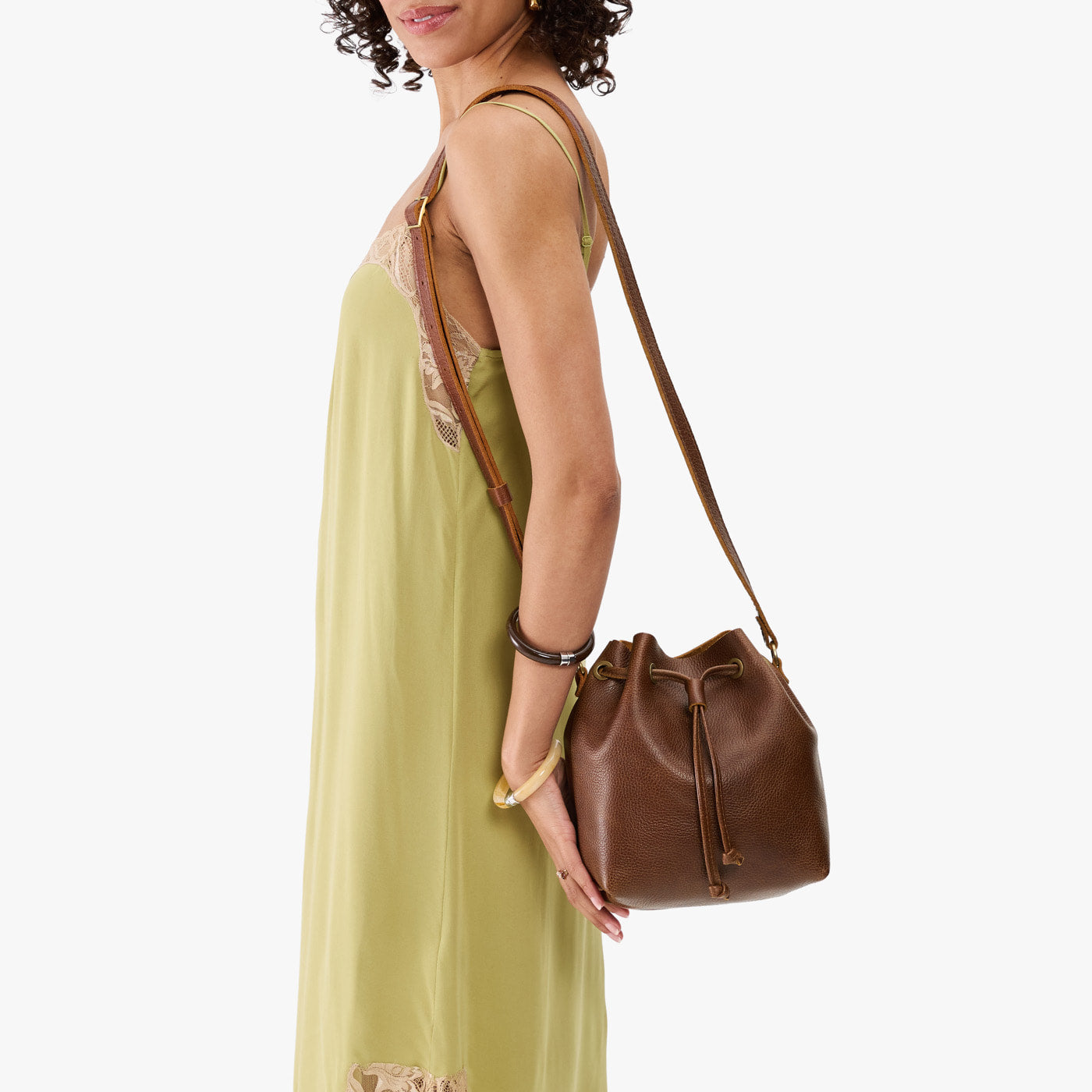 Asheville*Small | Model wearing slouchy crossbody bag with drawstring closure
