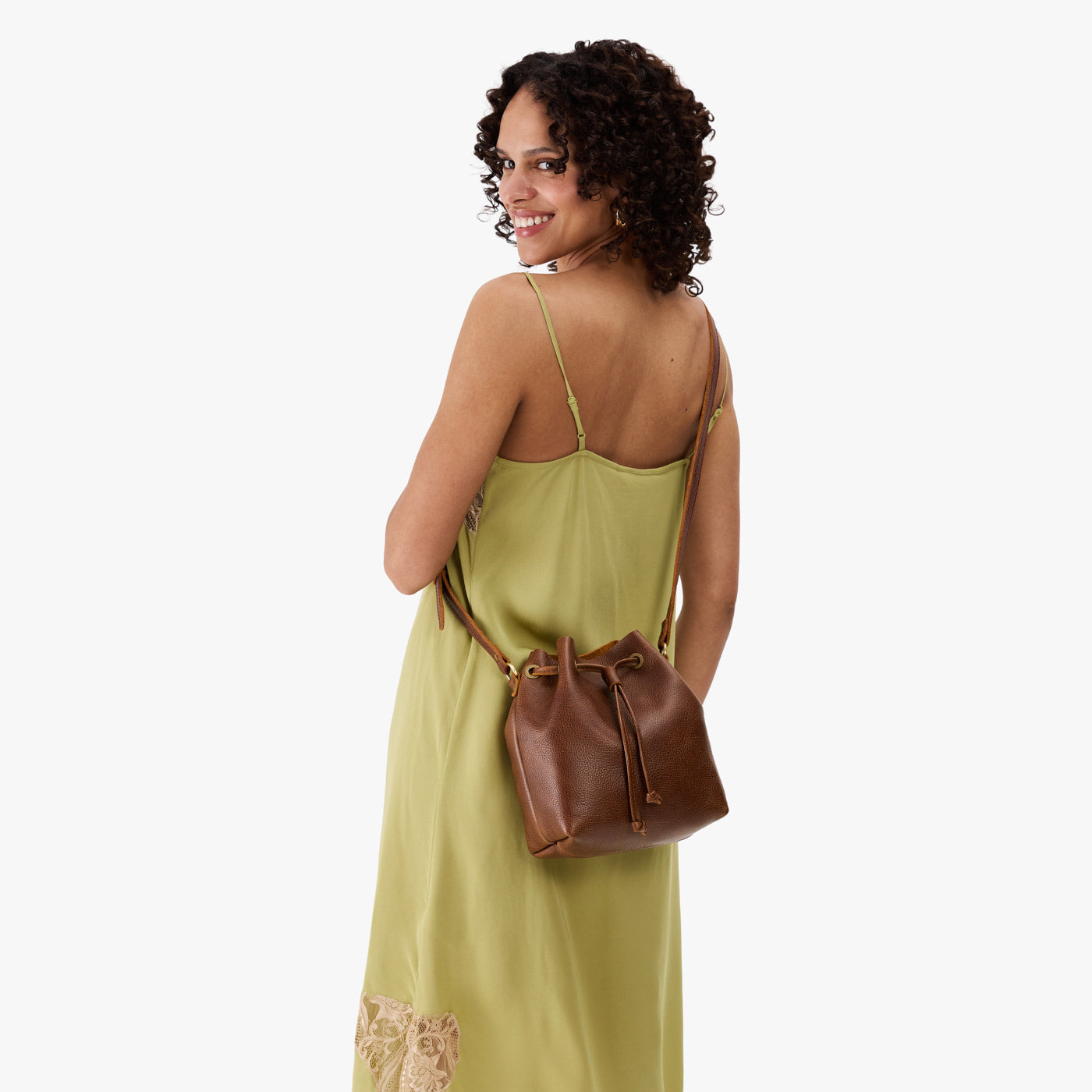Asheville*Small | Model wearing slouchy crossbody bag with drawstring closure